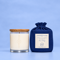 Ocean Breeze 300g Soy Candle in a glass container with timber lid and navy blue fabric gift bag