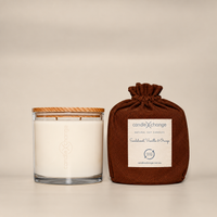 Sandalwood, Orange & Vanilla 400g Soy Candle in a glass container with timber lid and chocolate brown fabric gift bag