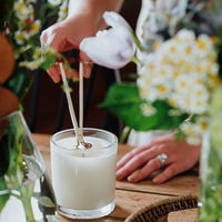 wick trimmer in use cutting candle wick