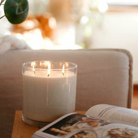 CandleXchange 1.5L candle sitting on side table next to lounge