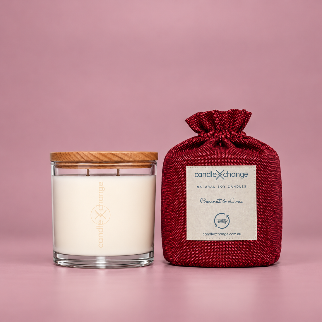Coconut & Lime 400g Soy Candle in a glass container with timber lid and burgundy fabric gift bag
