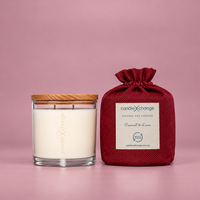 Coconut & Lime 400g Soy Candle in a glass container with timber lid and burgundy fabric gift bag