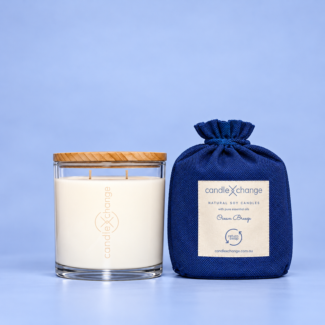 Ocean Breeze 400g Soy Candle in a glass container with timber lid and navy blue fabric gift bag