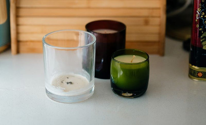 Various candle containers refilled